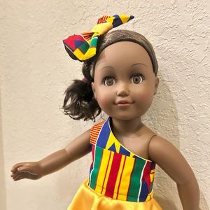 18” Doll with 2 additional doll clothes and accessories.